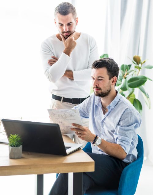 two-male-businessmen-working-office